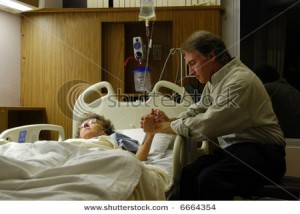 stock-photo-holding-the-hand-of-a-sick-loved-one-in-the-hospital-and-praying-6664354